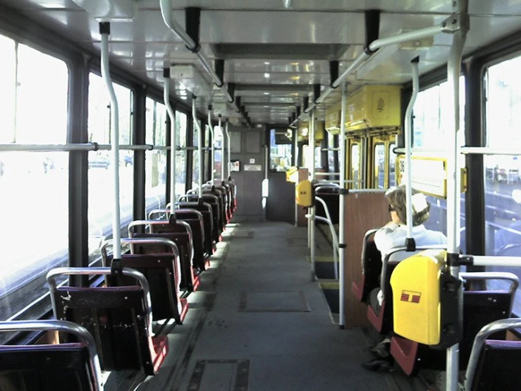 empty passenger bus with lots of seat covers