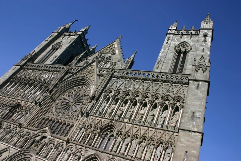 a tall cathedral with a clock on it's side