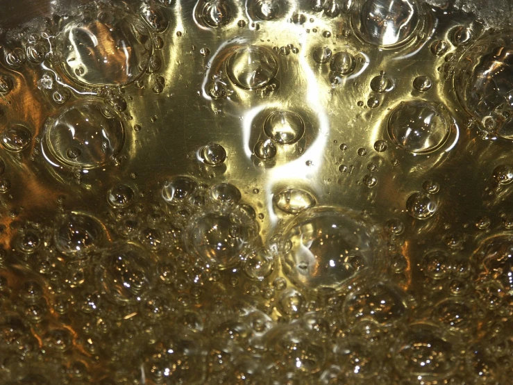 a metal sink topped with bubbles of liquid