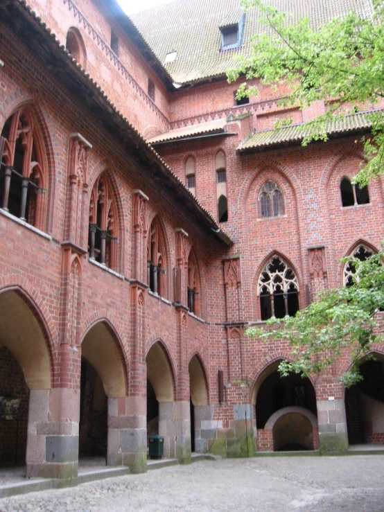 the courtyard in front of an old building, with windows