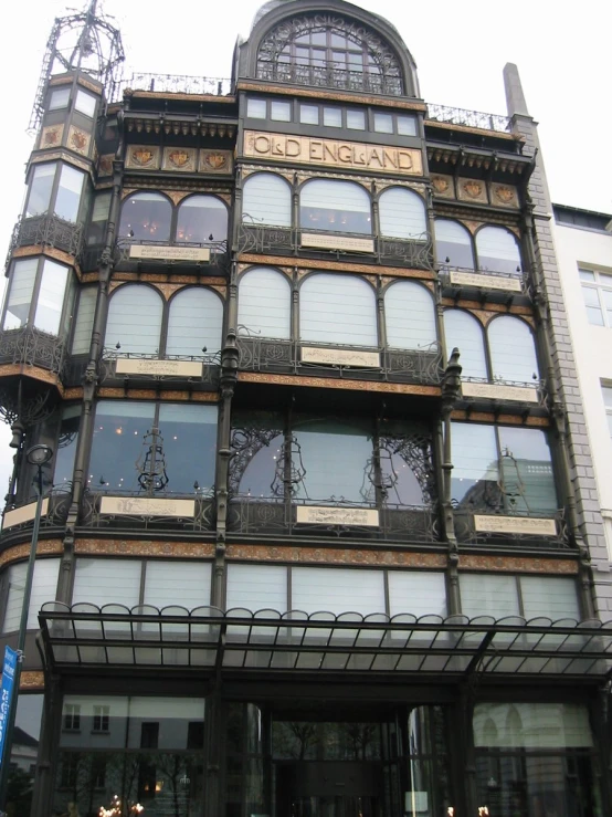 a large old building has windows and metal trim