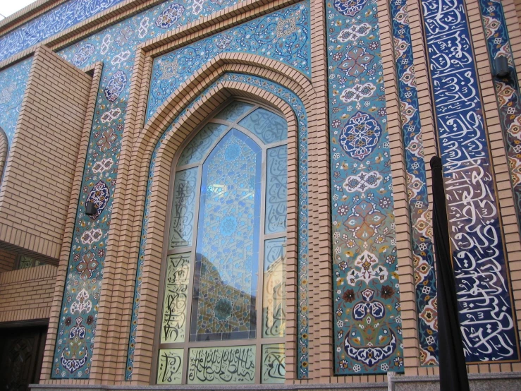 a large brown and blue building with lots of windows