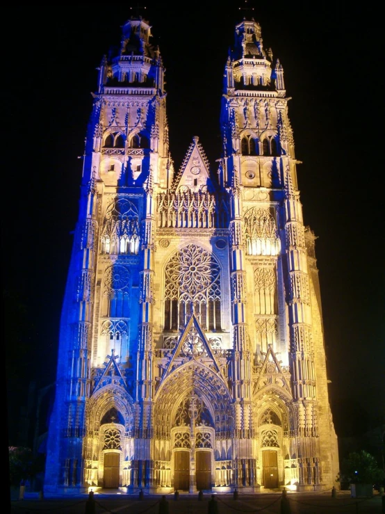 illuminated cathedral of a gothic castle at night