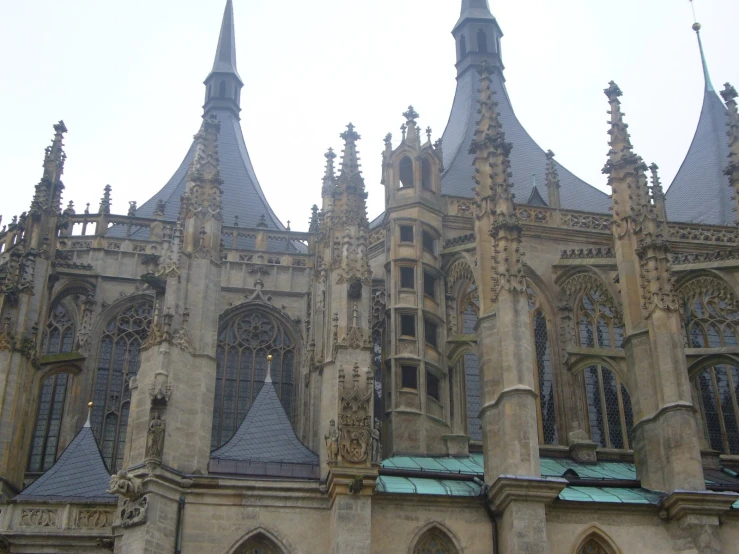 two towers on top of a building with lots of windows