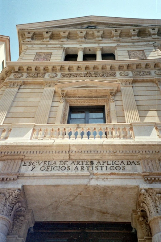 the tall building is empty outside, and has intricate architecture