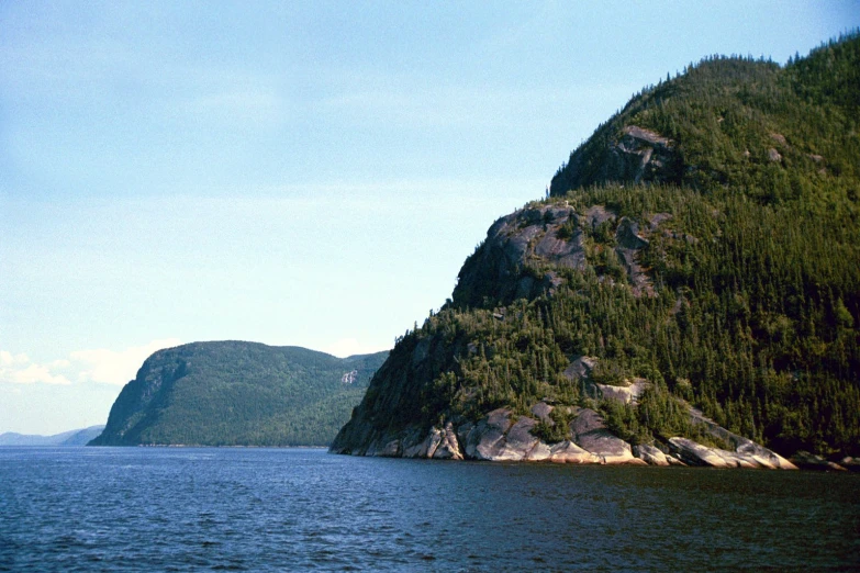 a body of water near two large hills