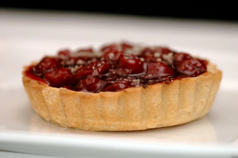 a white plate topped with pastry and dessert