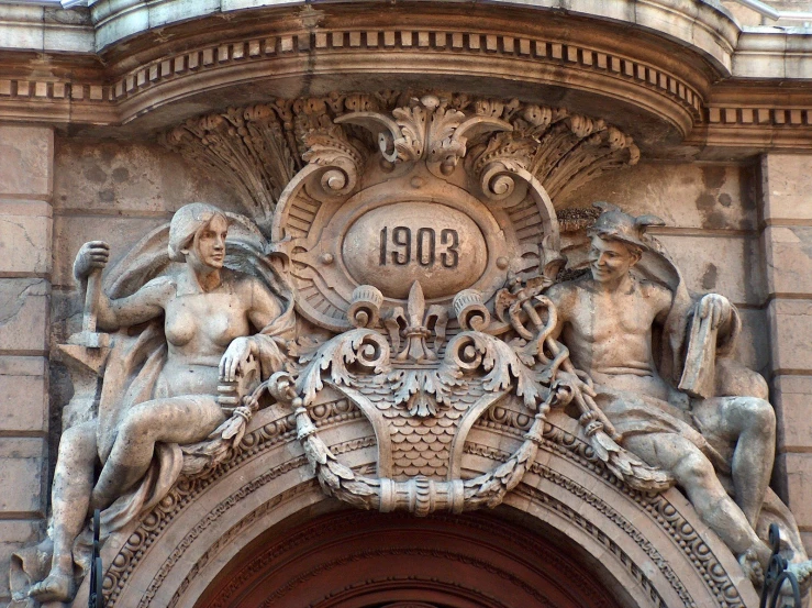 closeup of an ornate entry door with statues