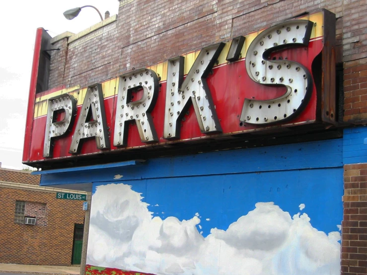 a large sign is hanging over the building