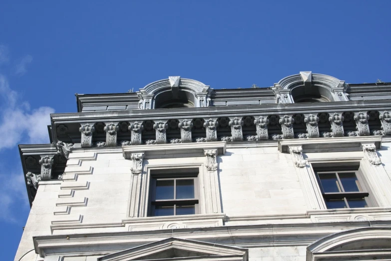 the top of a very old building with windows