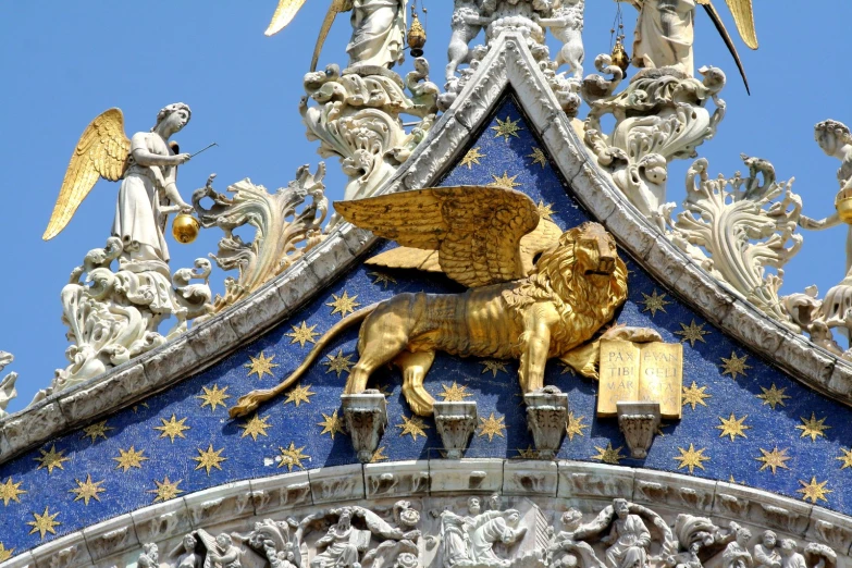 a gold lion sculpture in the center of a building