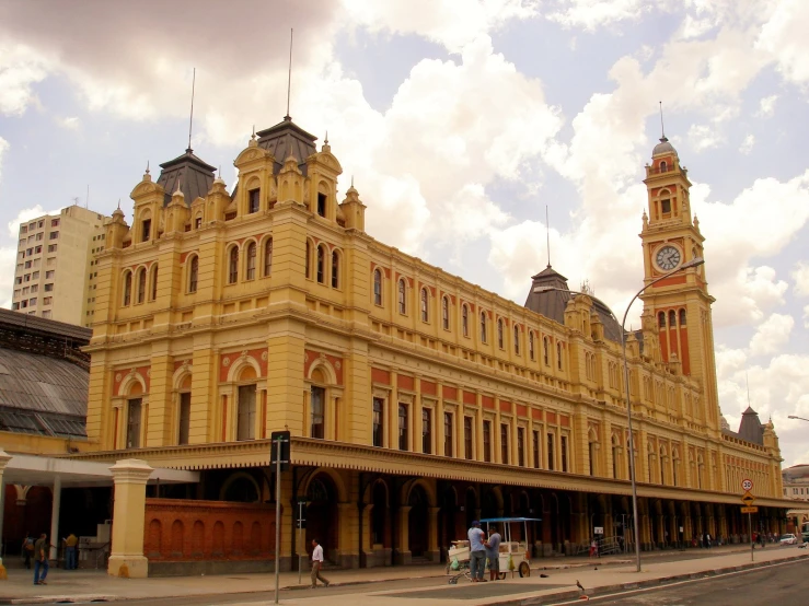 a large building has two towers and an ornate clock