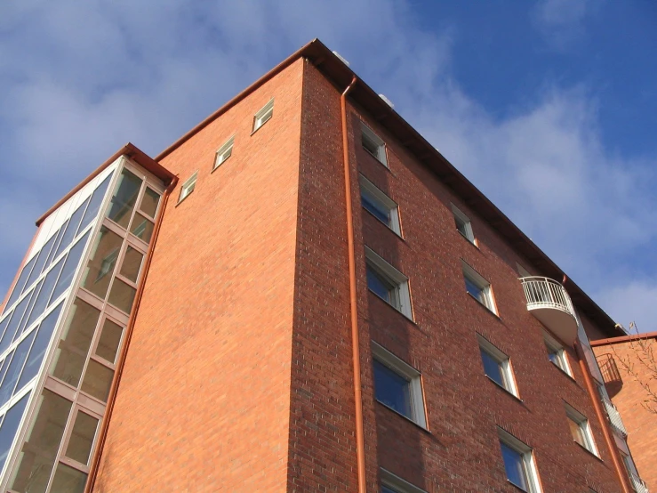 a red brick building with windows on the top