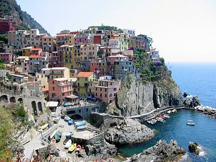 the beach houses have small docks and boats in it