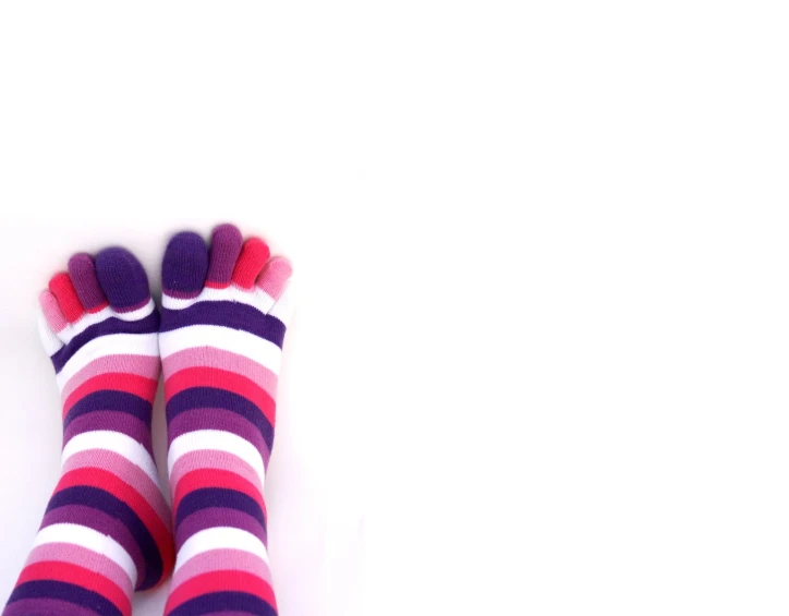a pair of colorful striped socks is on the floor