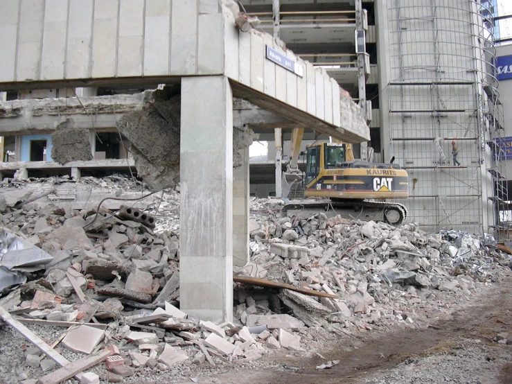 a building that has a large pile of rubble under it