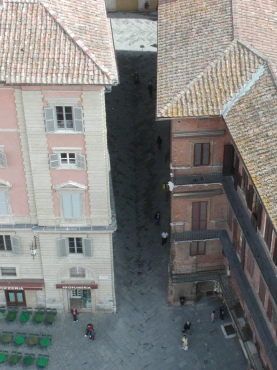 the view from above looking down at buildings and an open doorway