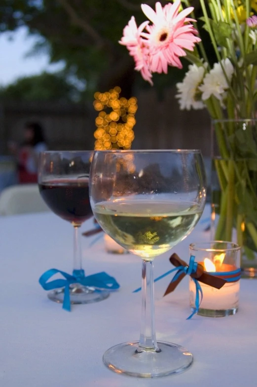 two wine glasses are sitting on a table