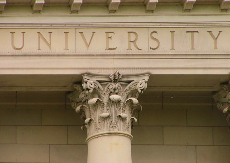 a close up of an architectural capital that says university