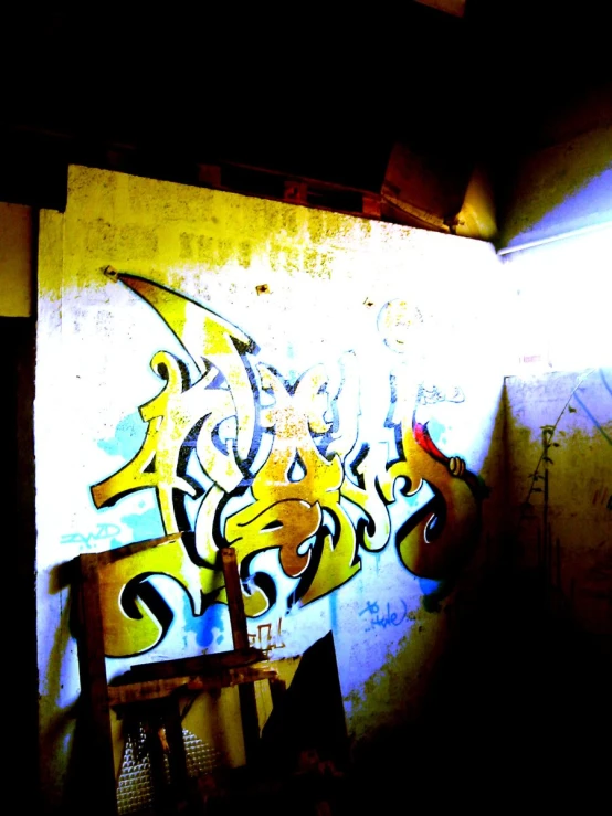 some spray paint is on the wall and is yellow