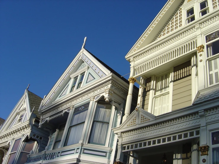 a clock in front of a row of houses