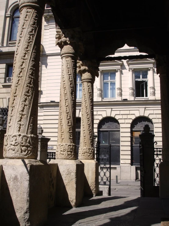 the building is made up of stone columns and is a tall, ornate column