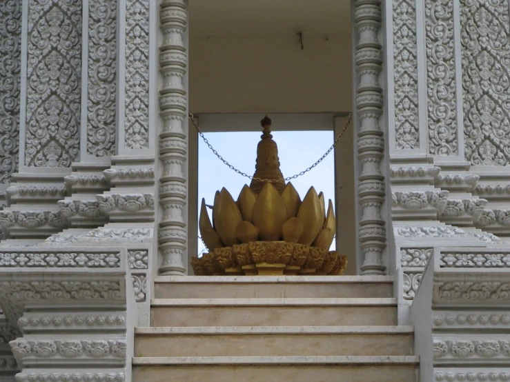 there are a lot of bananas displayed at the entrance of the building