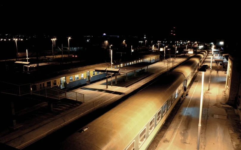 a train pulls into the station at night