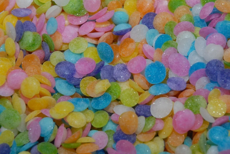 an image of lots of multi colored candy beads