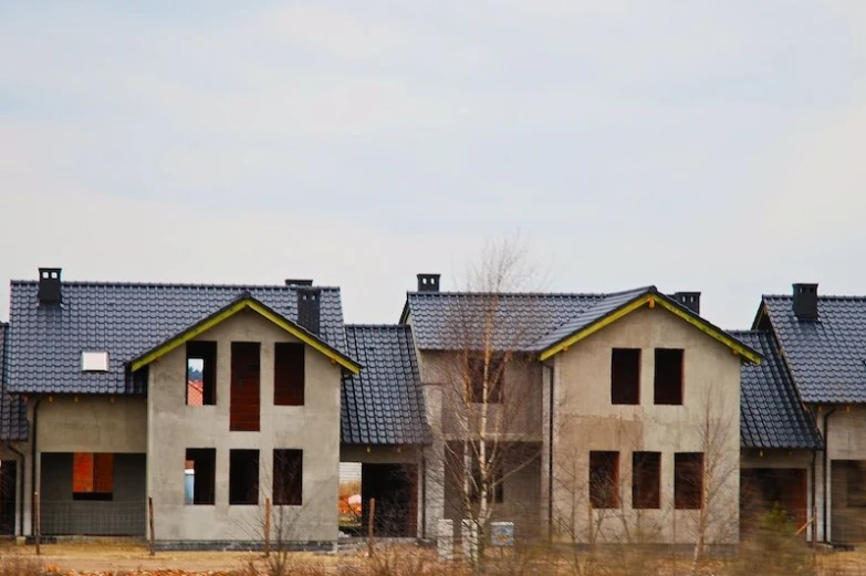 a group of small houses with several windows