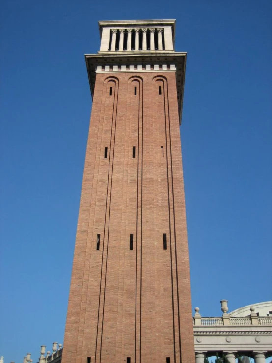 the clock tower on the building is taller than it looks