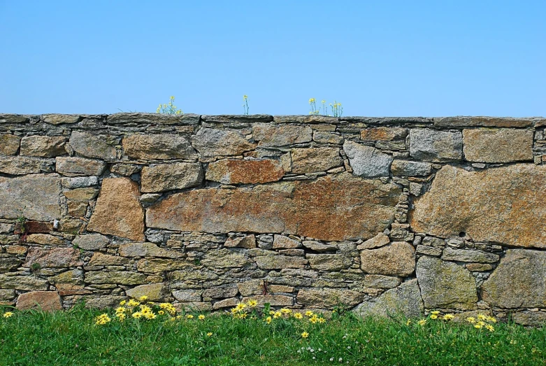 an old stone wall that is made from rocks