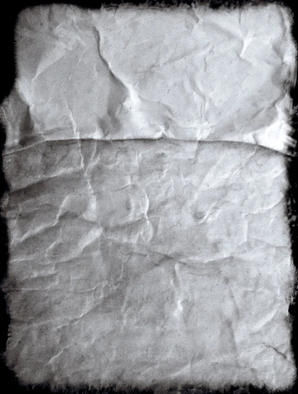 old gray paper textured in the dark
