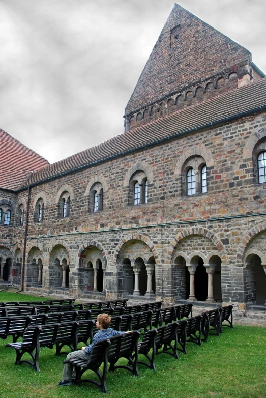 the building is a large courtyard with a little bench