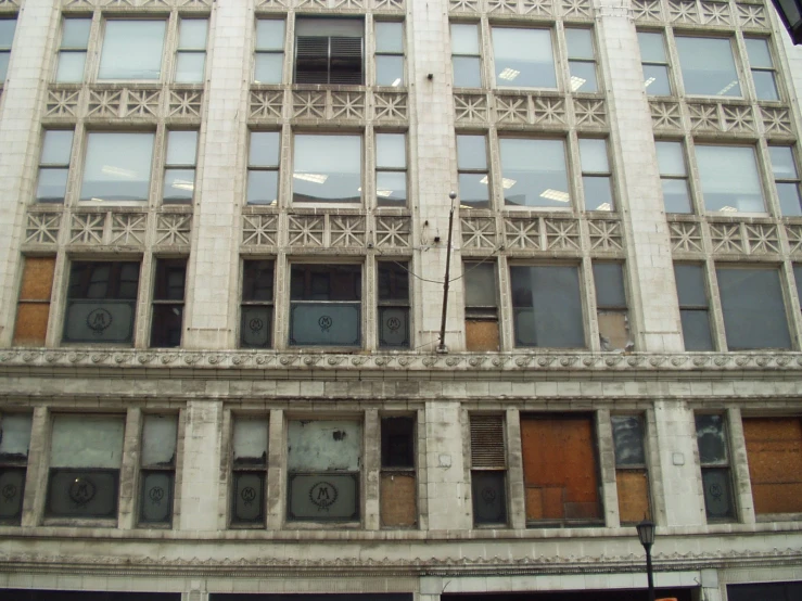 the front of a white building with lots of windows