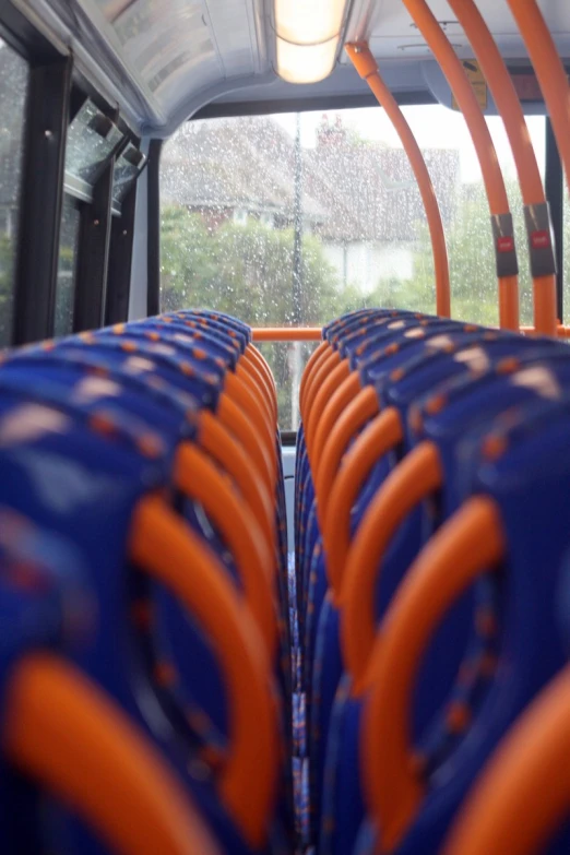 seats are lined up on the side of the bus