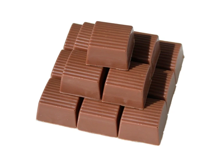 a pile of chocolates laying in the shape of squares
