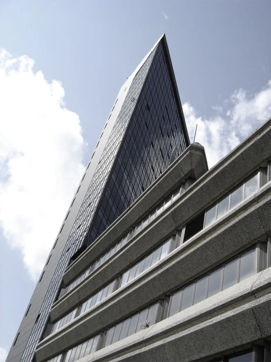 the view of a very tall building from below