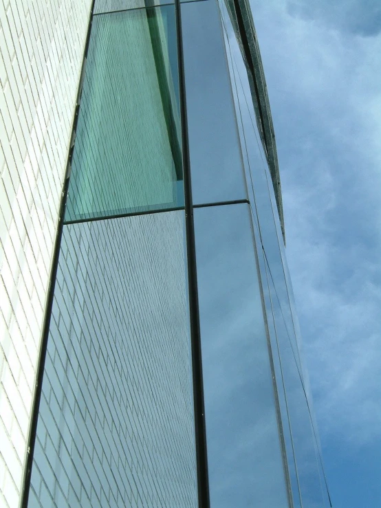 the corner of a large building with a very large tower