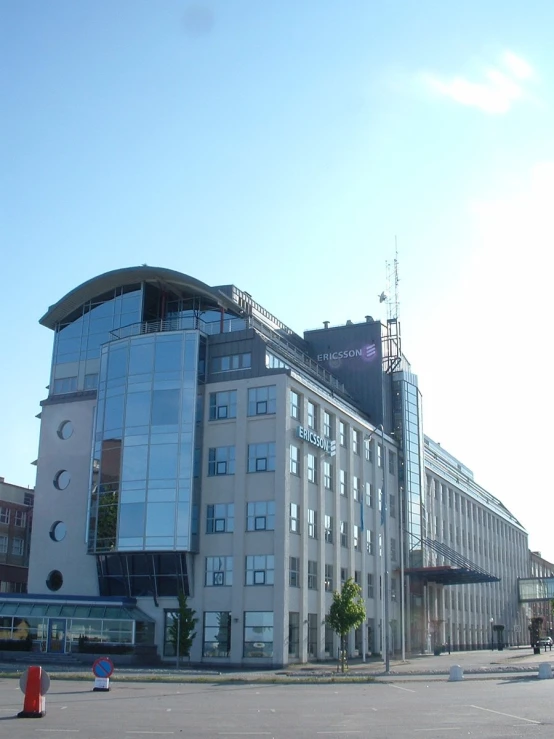 a very big pretty building in the middle of a road