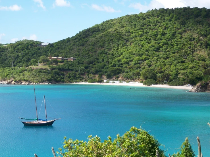 a sail boat in a large body of water