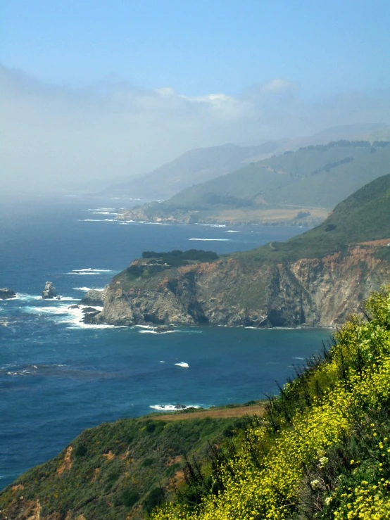 a view of the ocean from an overlook of the cliffs and water