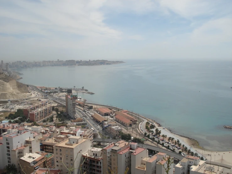 a city sits overlooking the ocean and beach