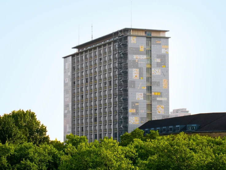 a very tall building on the side of a street