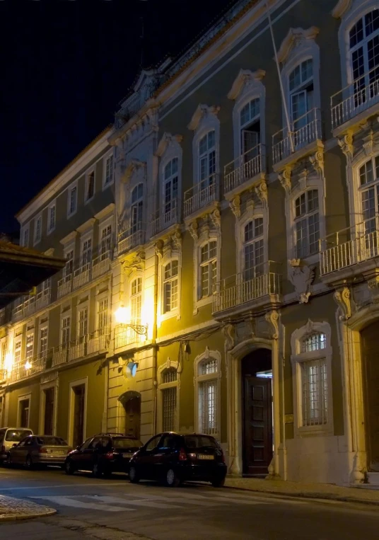 a city street is lit up at night