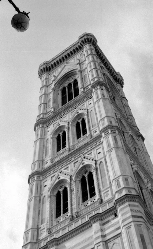 a black and white picture of a tall clock tower