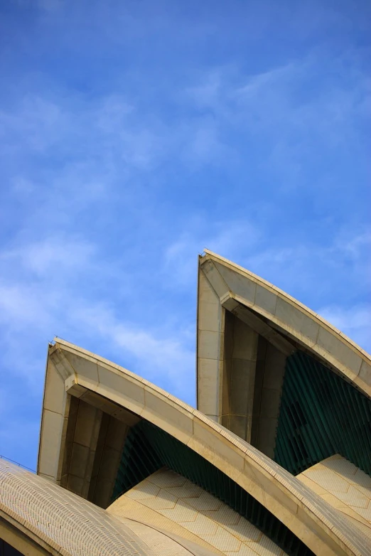 a close up of an architectural building with blue skies