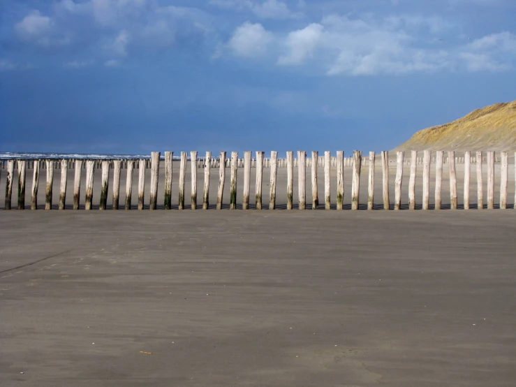 a surfboard that is leaning on the beach