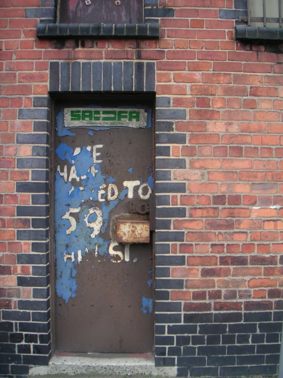 this door is located in front of an old brick building