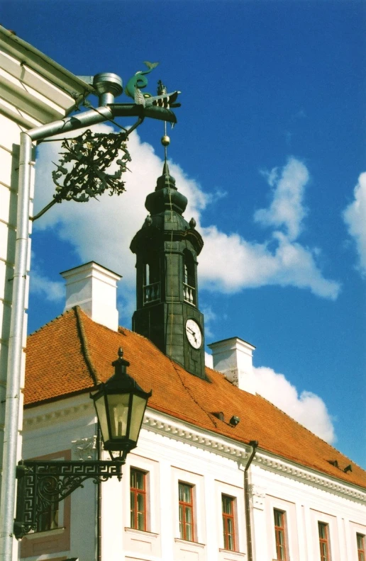 a clock tower sitting on top of a white building